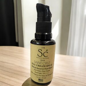 Day cream bottle on wooden table.