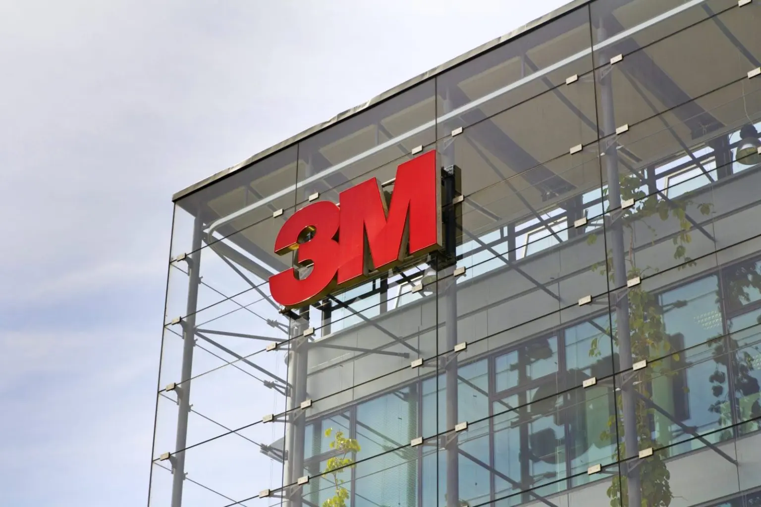 3M logo on glass building facade.